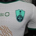 Official Al-Ahli Saudi away jersey with team crest and player number 24. Authentic football apparel.