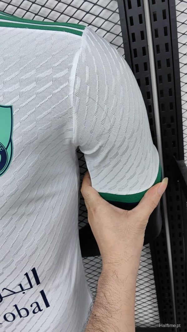 Official Al-Ahli Saudi away football jersey with team logo and green accents.