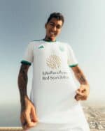 Official Al-Ahli Saudi away jersey for players, featuring team logo and sponsor.