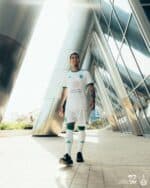 Soccer jersey for Al-Ahli Saudi away match, featuring player version design with team logo and numbe.