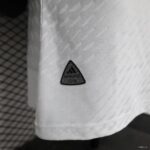 Authentic Adidas badge on white fabric, lightweight and breathable material.