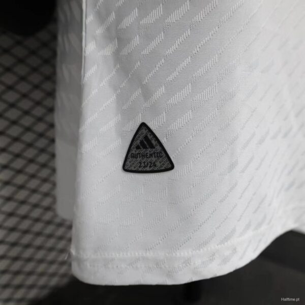 Authentic Adidas badge on white fabric, lightweight and breathable material.