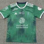 Al-Ahli Saudi football jersey for fans, green color, official team logo, and sponsor details.