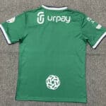 Authentic green Al-Ahli Saudi soccer jersey with sponsor logos, perfect for fans and players.