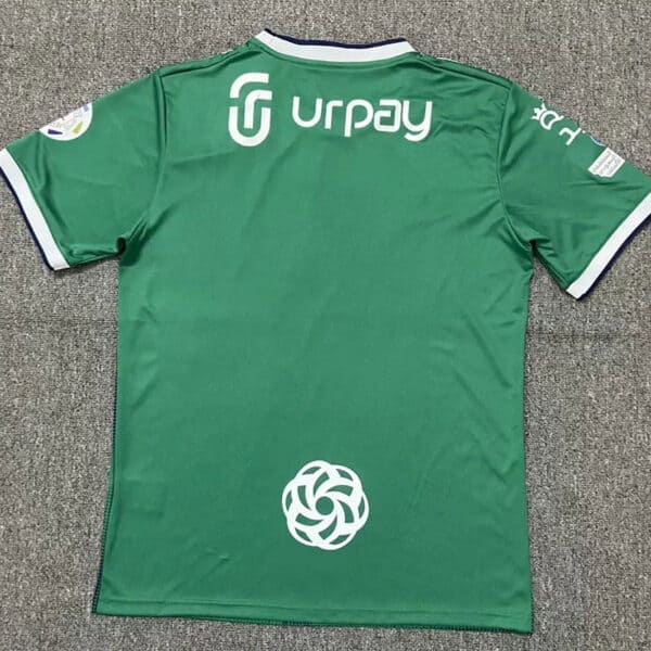 Authentic green Al-Ahli Saudi soccer jersey with sponsor logos, perfect for fans and players.