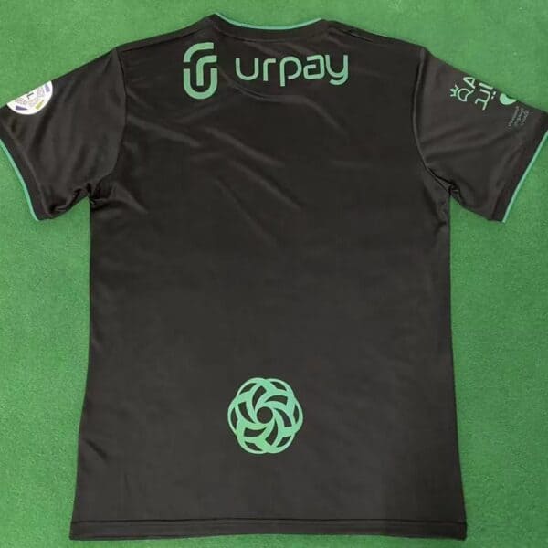 Authentic Al-Ahli Saudi third football jersey for fans, featuring team logo and sponsor design.