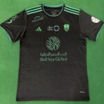 Al-Ahli Saudi third match jersey for fans, black with green accents, featuring sponsor logos and tea.