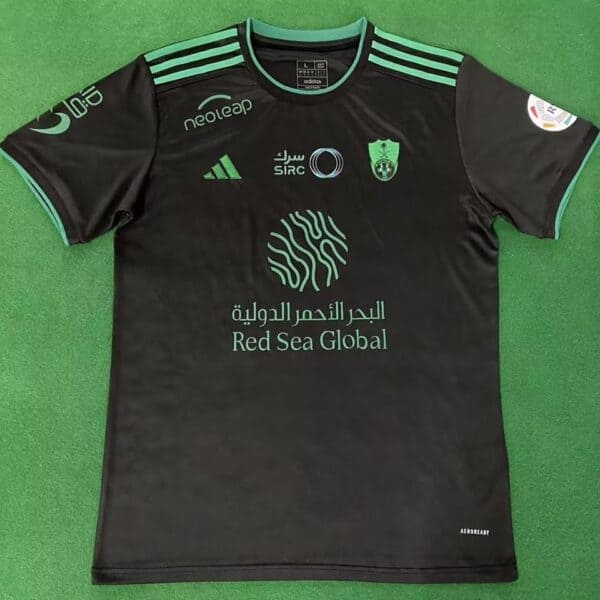 Al-Ahli Saudi third match jersey for fans, black with green accents, featuring sponsor logos and tea.