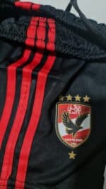 Official Al Ahly Club away football jersey for kids 2023/24 season.