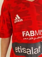 Al Ahly Club Kids Home Football Jersey 2022/23, red with white Adidas logo and sponsor, perfect for.
