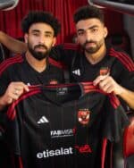 Al Ahly SC away football jersey 2023-2024 with team crest and sponsor logos.