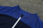 Blue Al Nassr football tracksuit top with white zipper for 2023/24 season.