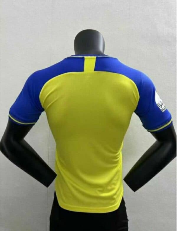 AL Nassr home player jersey with Ronaldo 7, authentic football merchandise.