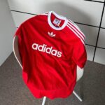 Adidas Adicolor red T-shirt with white logo and stripes, casual sportswear for men and women.