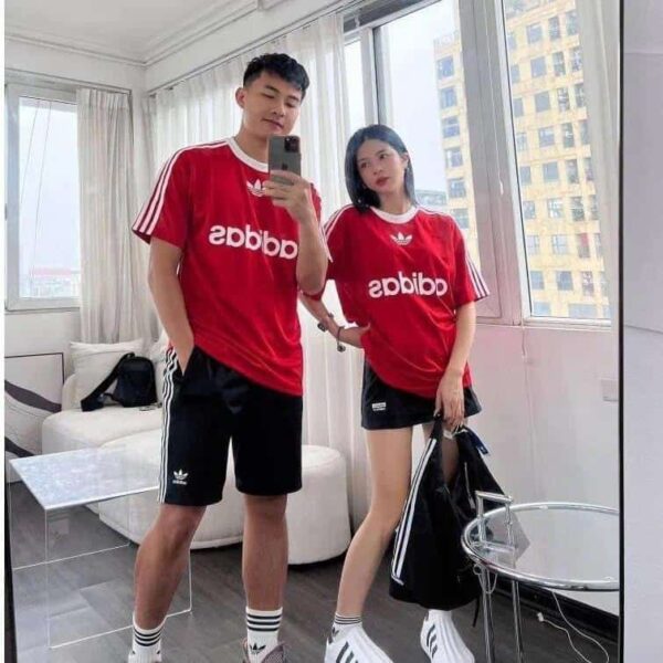 Red adidas Adicolor football T-shirt for men and women, stylish sportswear.