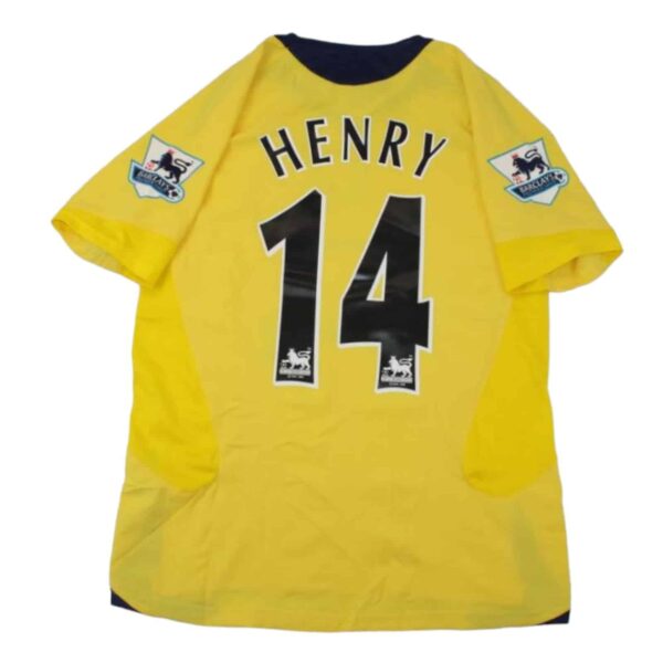 Official Arsenal Henry 14 away kit with team patches, yellow color, and player name and number.