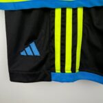 Kids Gunners away football kit 2023/24 with Adidas logo and vibrant colors.