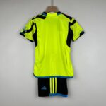 Youth Arsenal away football kit 2023/24 with vibrant yellow and black design.