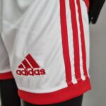 Official Arsenal Kids Home Football Kit 2022/23 with Adidas logo. Perfect for young fans and players.