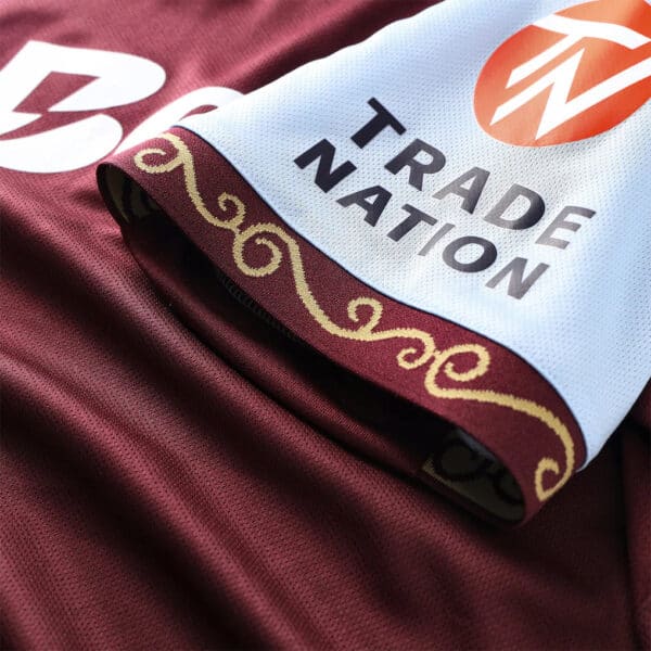 Aston Villa 2025/26 home football jersey with Trade Nation logo, featuring maroon and sky blue color.