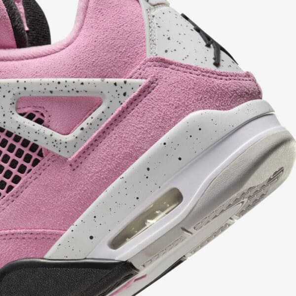 Air Jordan 4 Orchid pink and white athletic shoes with black speckled accents.