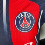 PSG 2023/24 home football jersey with Paris Saint-Germain logo and design details.
