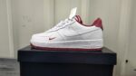 Nike Air Force Low 1 sneakers in white and red for men and women.