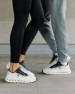 Athletic Cloudtilt trainers in black and ivory, perfect for running and casual wear, featuring light.