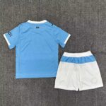 Kids Manchester City home football kit 2025/26 with blue jersey and white shorts.