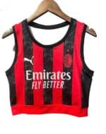AC Milan women's crop top with red and black stripes, official team logo, and Emirates sponsor.