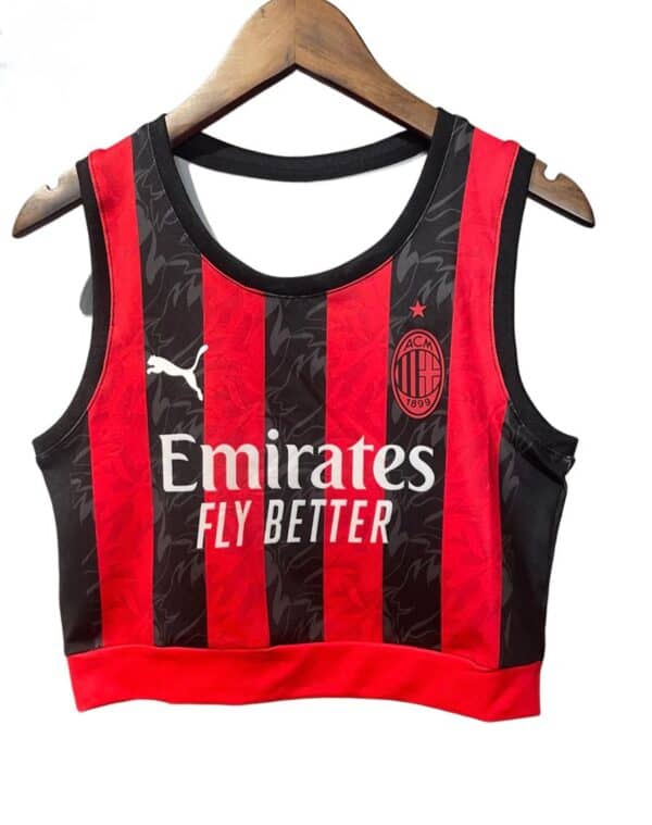 AC Milan women's crop top with red and black stripes, official team logo, and Emirates sponsor.