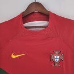 Portugal 2022 World Cup home jersey with Ronaldo emblem, red and green design.