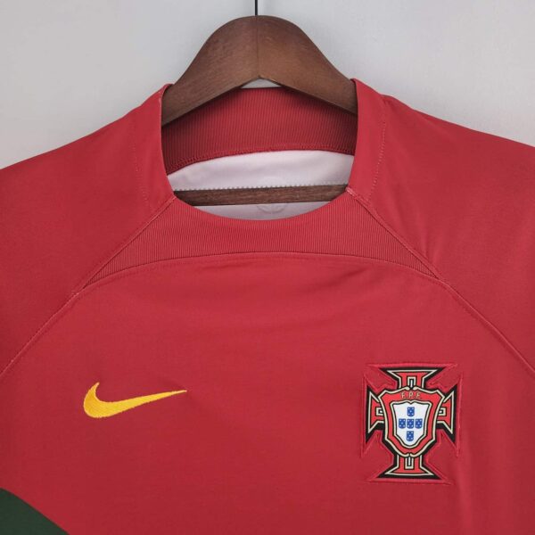Portugal 2022 World Cup home jersey with Ronaldo emblem, red and green design.
