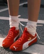 Red and white Puma Speedcat OG football shoes for men.