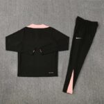 Black and pink sports tracksuit for men, Nike logo on pants, comfortable athletic wear.