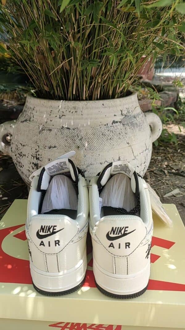 Nike Air Force 1 Low sneakers in white and black.