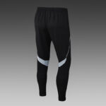 Black Adidas tracksuit pants with white accents, athletic fit, perfect for sports and casual wear.