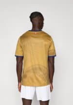 Authentic yellow football jersey with blue accents, back view.