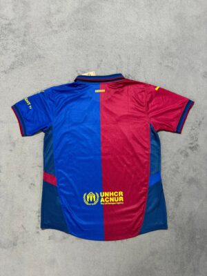 Unisex football polo jersey in blue and red, featuring UNHCR and ACNUR logos, perfect for sports fan.