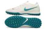 High-performance Nike Phantom GX II Elite Society soccer cleats in white with green accents, designe.