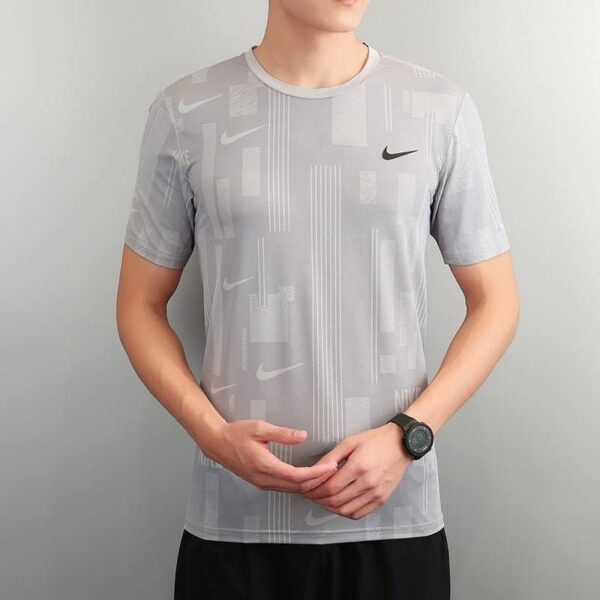 Nike men's athletic shirt with four color options, lightweight and breathable fabric.