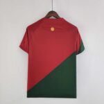 Portugal 2022 World Cup home football jersey with red and green design, Ronaldo logo, and team emble.