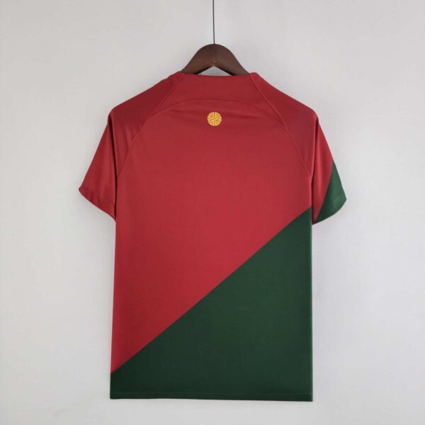 Portugal 2022 World Cup home football jersey with red and green design, Ronaldo logo, and team emble.