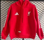 Red Liverpool FC hoodie with LFC crest and Adidas logo, sportswear for football fans.
