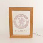 Chelsea FC logo framed display for football fans.