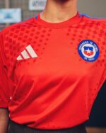 Chile national football team home jersey 2024/25, authentic red kit with blue accents and team crest.