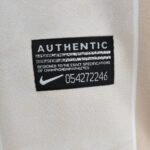 Authentic Nike tag on Corinthians 2010 away football jersey, detailed shot.