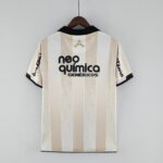 Authentic Corinthians 2010 away football jersey with beige and black stripes, featuring sponsor logo.