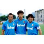 Napoli football players in 1987/88 Maradona home kit, celebrating victory.