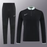 Nike Dri-Fit black tracksuit with white accents, ideal for sports and training.